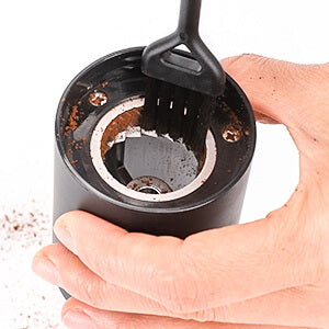 Cleaning brush included for easy cleanup. The removable upper burr, hopper and chamber removes easily for effortless cleanup. Do not use water or other liquids to clean the inside of the espresso bean grinder/burrs.